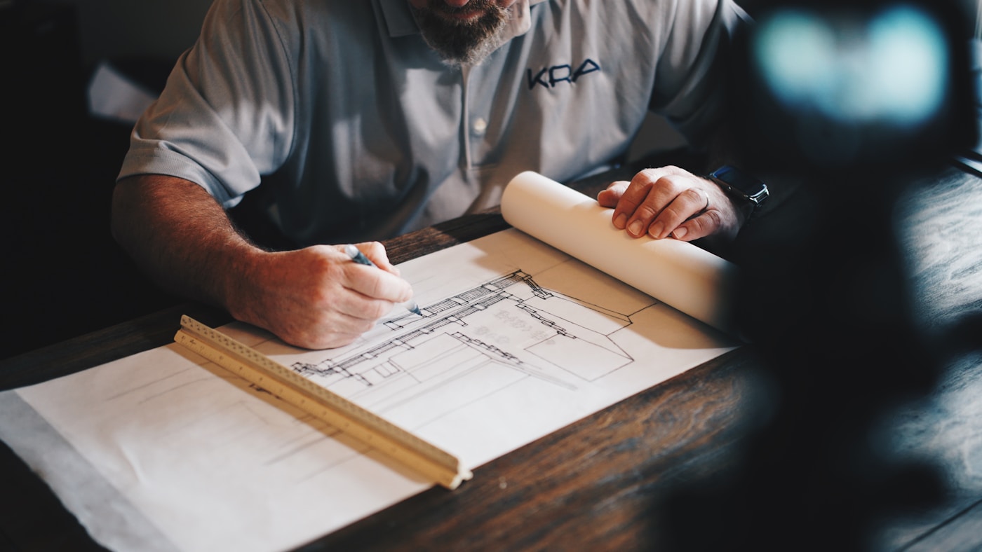 Builder reviewing residential construction plans