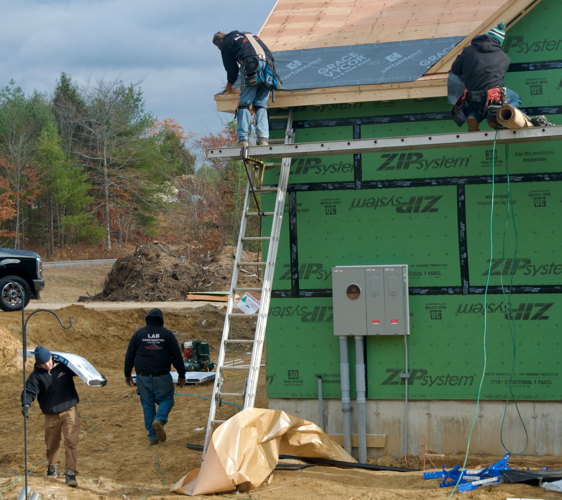 Applying underlayment at a roof edge